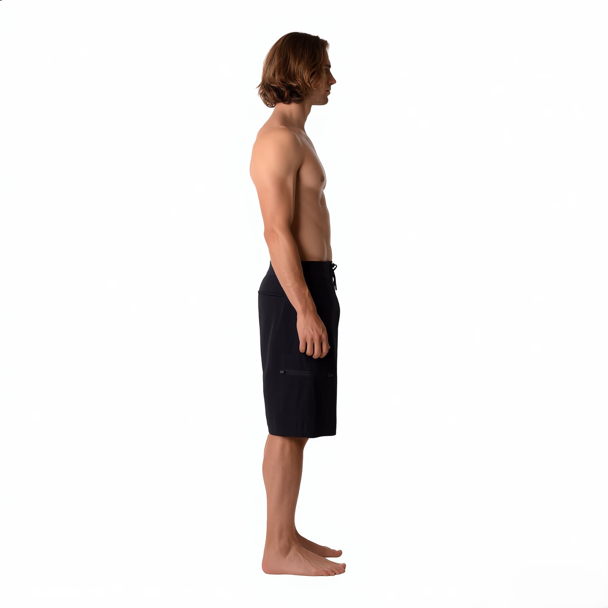 The boardshort worn, side view, showing the side seam and the thigh pocket in profile.